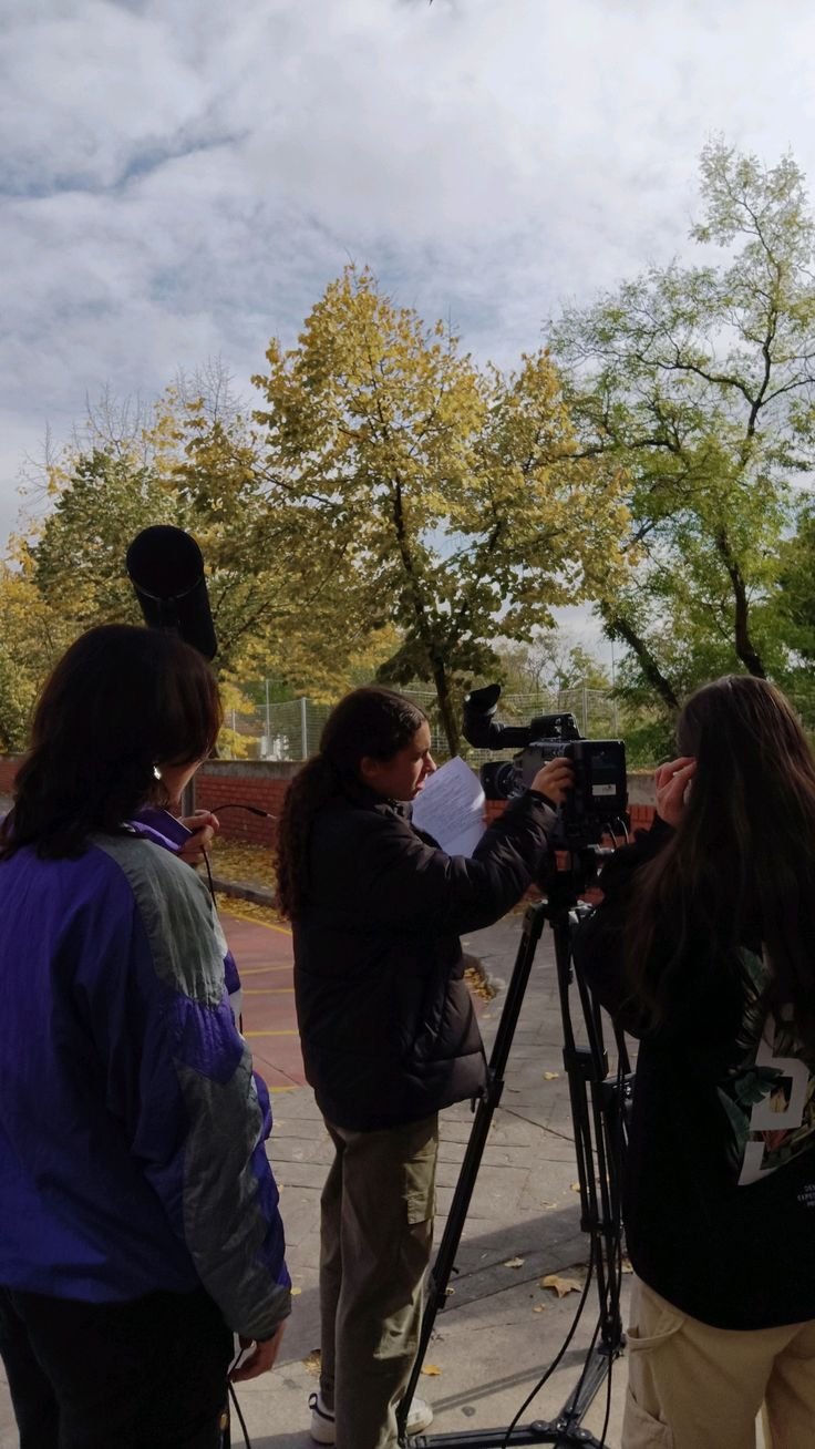 Youth environmental reporter filming and interviewing community members on local conservation efforts