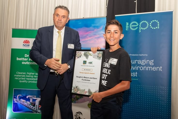 Young environmental hero receiving recognition for leading a local ecological project