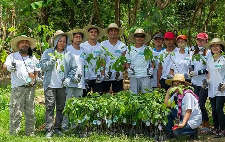 Youth activist leading a funded community tree planting and environmental action day