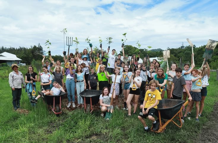 Youth climate ambassadors collaborating during an environmental leadership and tree planting workshop